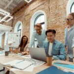 Why Every Startup Needs a Strong Business Case Business Case Managers man and woman in bright modern office. Collaborative efforts to achieve success. Lifestyle of multinational team of businessmen and women in workplace