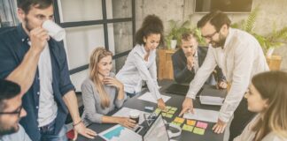 Business Plan Guide: How Founders Boost Startup SuccessYoung business people meeting at office and discussing together a new startup project.