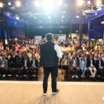 Startup Autobahn expo2025 by Plug and Play in Stuttgart STARTUP AUTOBAHN Plug and Play expo2025 Saeed Amidi on Stage @ the expo2024 in Stuttgart with audience in the Backround