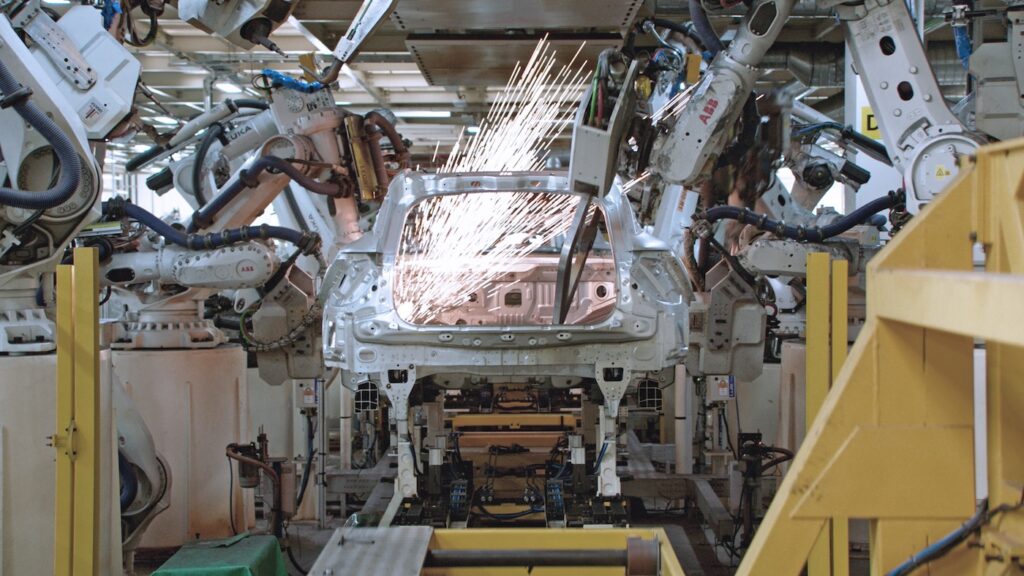 Polestar Vehicle in the production line in a plant with working welding robots