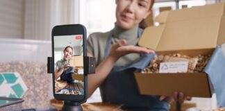 TikTok in 2025: Social Media Trends, Tools & Strategy tiktok-2025-social-media-trends SME owner go green net zero retail store live stream talk on phone showing eco care plastic free packaging box. Asia people young woman record video on tiktok IG reel instagram shop happy side hustle.